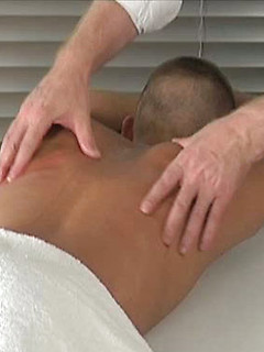 Kirk James lies relaxed as Sebastian massages his cock