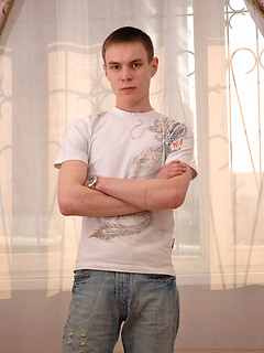 Twink grabs his crotch and poses for the camera