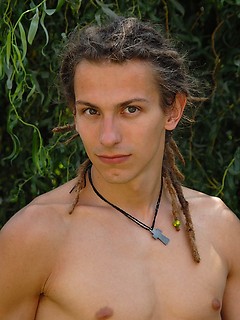 Young rasta boy relaxing in the garden