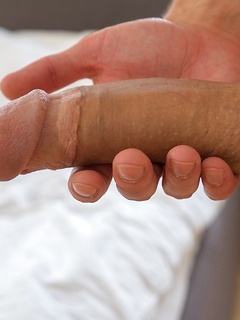 Tommy Hunter slowly strips and strokes his big thick cock.