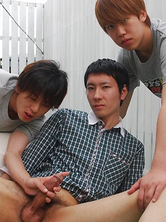 Kaede and Fuji grab the lube and a dildo and bend Jo over the small couch pulling off his shorts